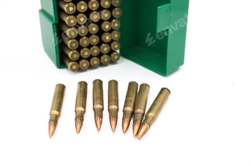 Preview: Detail of some war rifle bullets caliber 30-06 Springfield or 7.62x63mm and its open box behind