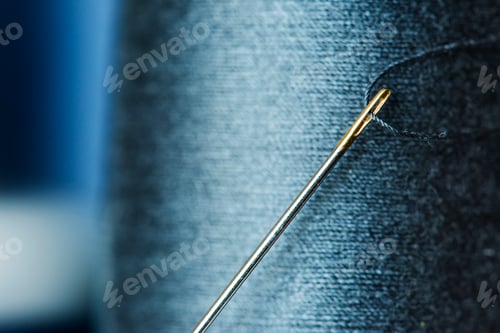 Preview: Sewing threads dark purple background closeup