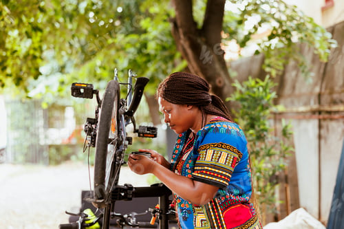 Preview: Woman repairing bicycle frame