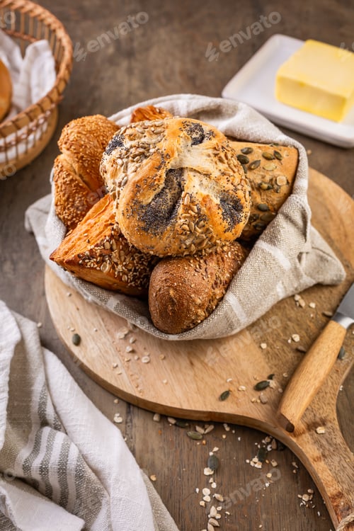 Preview: Assortment of bread, rolls and bakery products with salt, butter and seeds