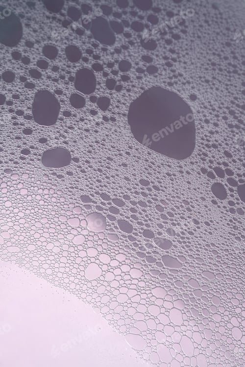 Preview: Fluffy white foam on a purple background.