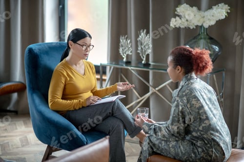 Preview: Beautiful Asian psychoanalyst supporting young military woman