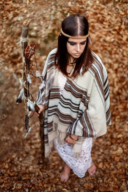 Preview: beautiful native indian american woman holding pikestaff with dream catcher