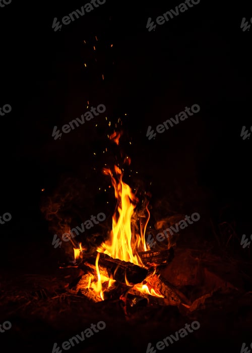 Preview: Fire burns at night in a tourist camp