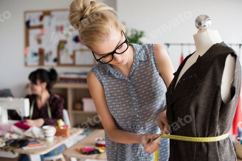 Preview: Blonde woman creating with big care
