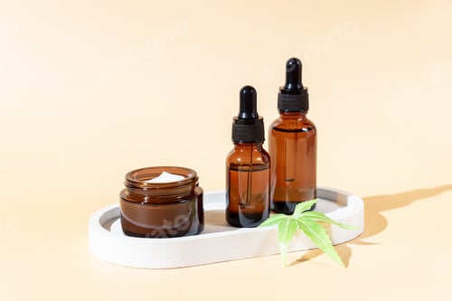Preview: Cosmetic cream and oil made of natural cannabis, hemp, moisturizing lotion with CBD. Copy space
