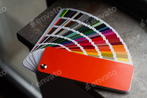 Preview: multicolor color paper sampler open on dark marble