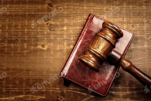 Preview: Image of wooden judge hammer on notepad