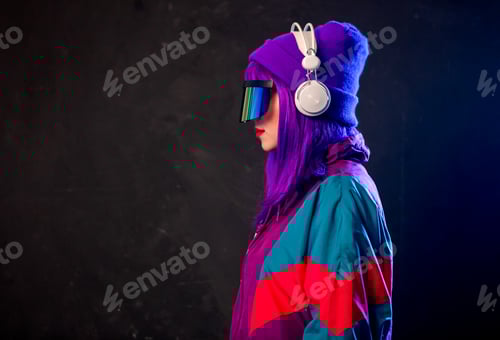 Preview: Stylish girl in cyber punk glasses and 80s tracksuit with headphones on dark background