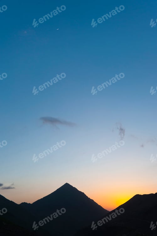 Preview: Tizi n Tamatert at sunset in the High Atlas Mountains, seen from Ouanskra, near Tacheddirt, Morocco,