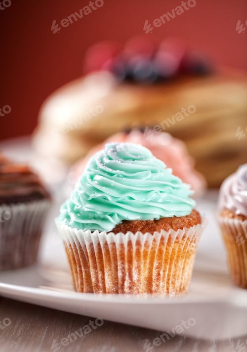 Preview: Colorful Cupcakes Displayed on a White Plate