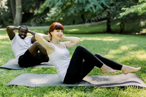 Exercising in the Park: Abdominal Crunches on Mats