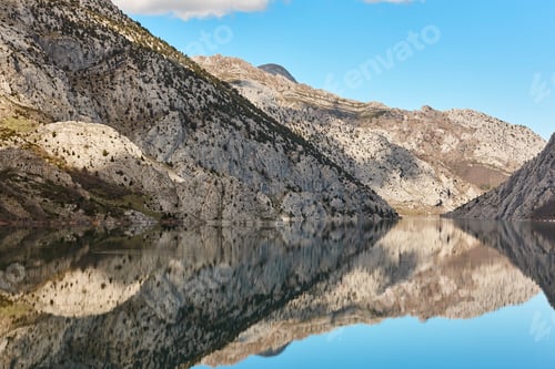 Preview: Picturesque reservoir and mountain landscape in Riano. Mirror effect. Spain