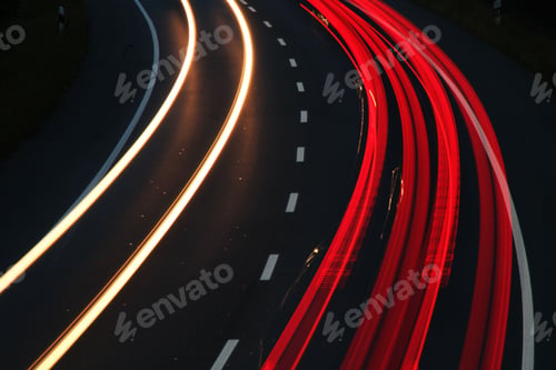 Preview: Nighttime urban landscape illuminated by a string of vibrant red light trails