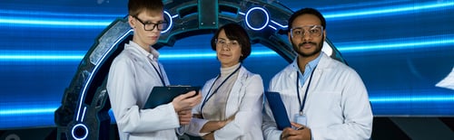 Preview: futuristic concept, creative multiethnic science team near new equipment in discovery center, banner