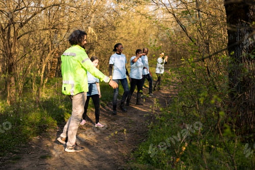 Preview: Supervisor of the rescue operation team leads his crew into the woods