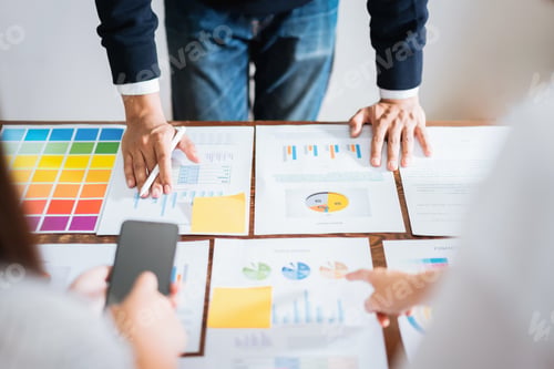 Preview: Business people meeting team working on wooden desk and hand man pointing to financial documents in