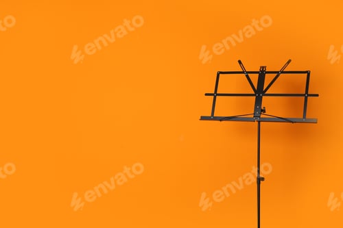 Preview: Empty music note stand on color background. Space for text