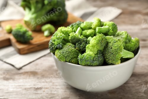 Preview: Bowl with fresh green broccoli on table