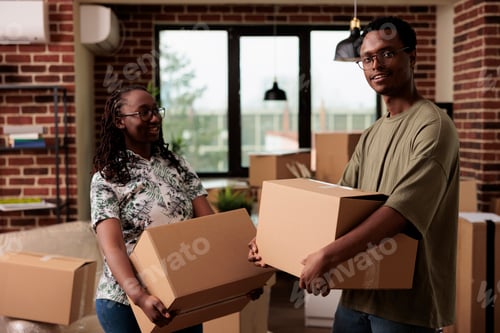 Preview: Portrait of african american homeowners feeling happy about moving household