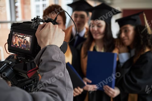 Preview: Multiethnic Young University Students Posing Together during Graduation