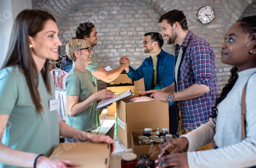 Preview: Group of volunteers working in community charity donation center.