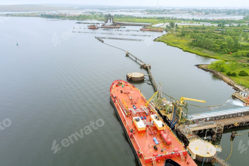Preview: Aerial view of oil rig platform in the harbor with oil tanker is transferring oil storage