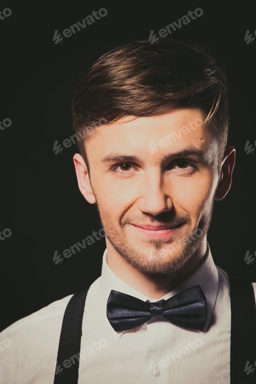 Preview: Model. The Guy In The White Shirt And Black Bow Tie. Portrait.