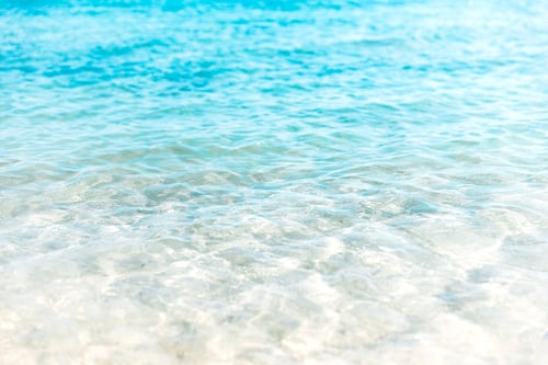 Preview: Aerial view of clear turquoise sea and waves. Soft ocean wave on the sandy beach