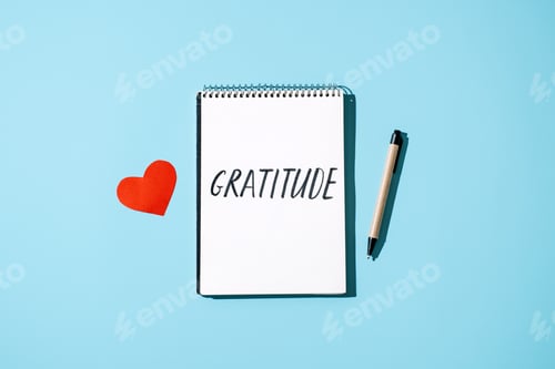 Preview: How to Practice Gratitude. Word Gratitude in open notebook on table.