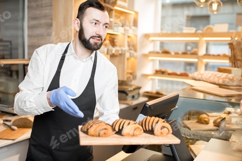 Preview: Seller offering croissants in the store