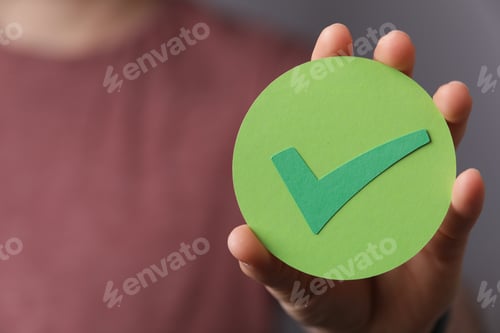 Preview: Man holding a green check mark