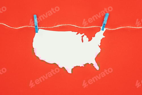 Preview: top view of piece of blank paper in shape of map hanging on rope isolated on red