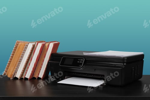 Preview: Home laser printer on desk against green background