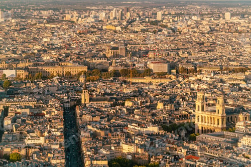 Preview: Aerial view of the densely populated city of Paris with buildings and a river during