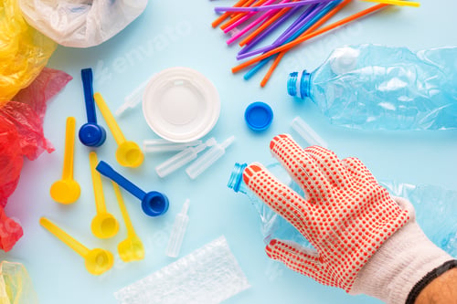 Preview: Worker sorting plastic garbage for recycling