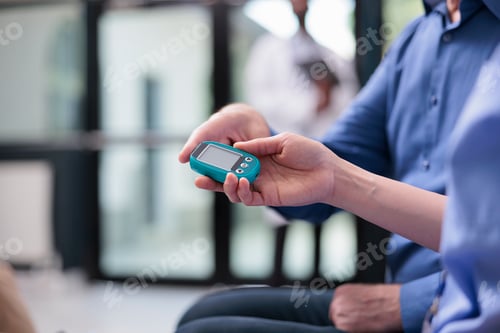 Preview: Close up of medical assistant taking old patient insulin level test using glucometer during