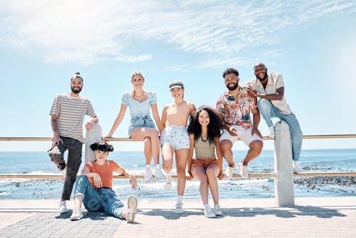 Preview: Full length shot of a diverse group of friends bonding together during a day outdoors