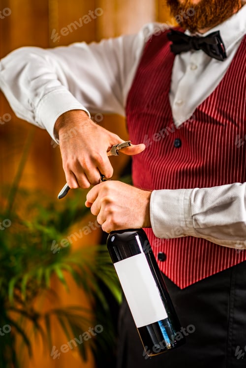 Preview: Sommelier opening wine bottle