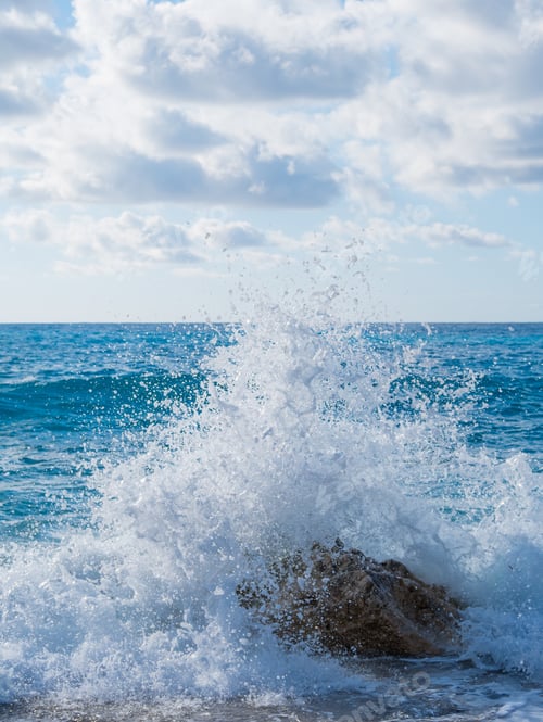 Preview: waves breaking on a stony beach