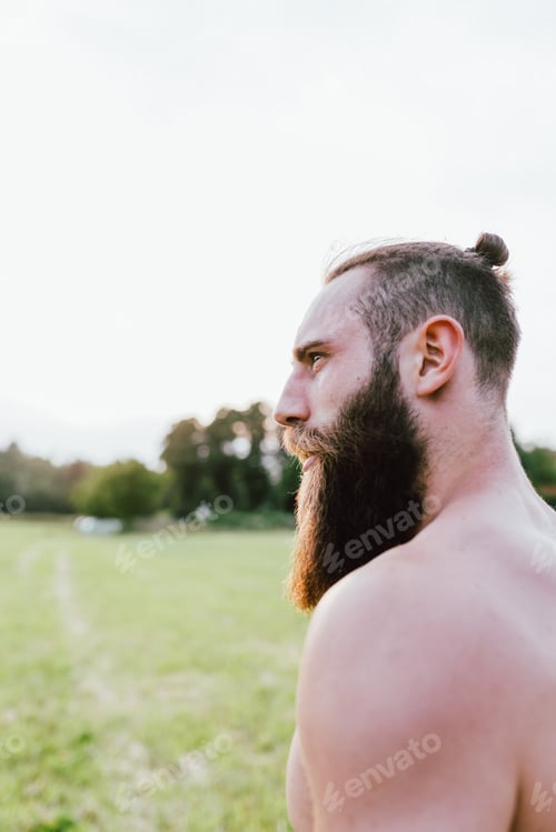 Preview: portrait young bearded man bare chested outdoor
