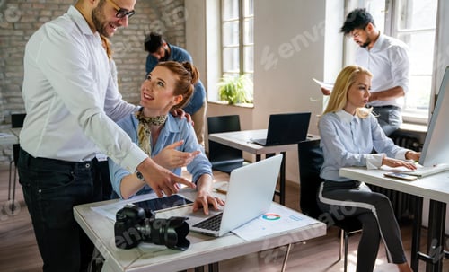 Preview: Creative startup young multiethnic business people working together at designer agency in office