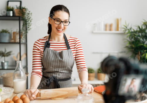 Preview: woman is recording vlog about cooking.