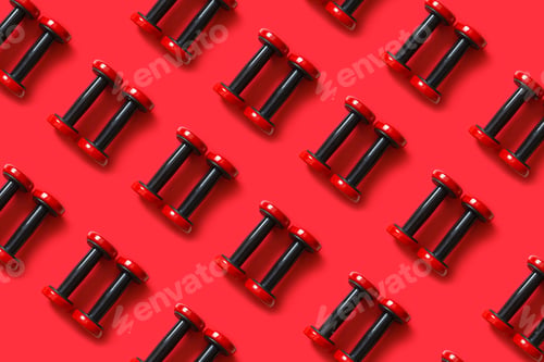 Preview: Seamless pattern of red exercise dumbbells isolated on red background