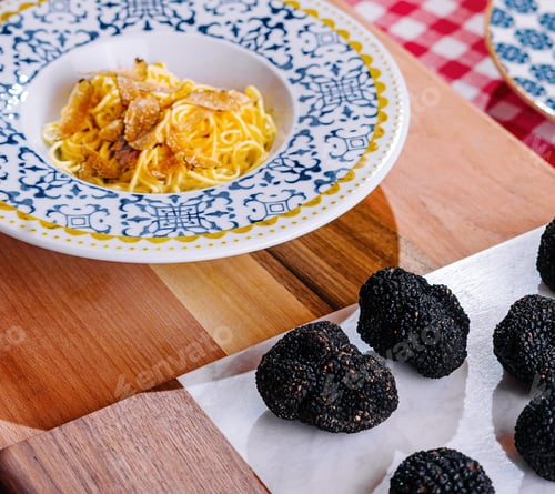 Preview: Chef Grating Truffle Shavings on Pasta with Parmesan