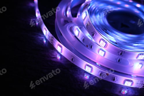 Preview: Closeup shot of purple LED strip lights isolated on black background