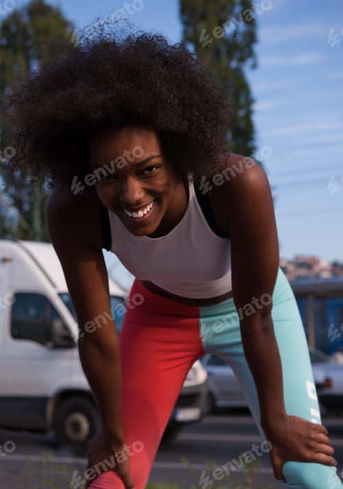Preview: Portrait of sporty young african american woman running outdoors