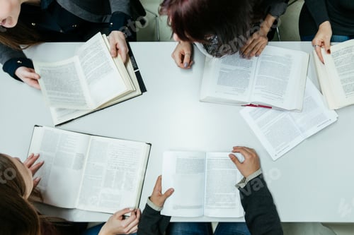 Preview: Group of students learning together in a library