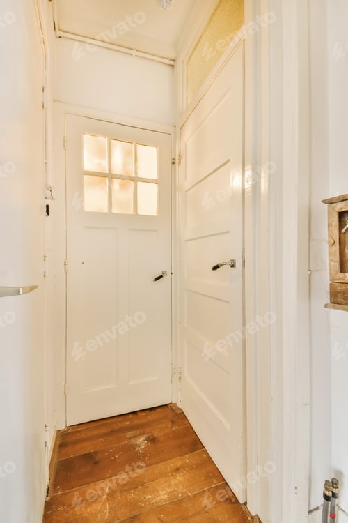 Preview: a small hallway with a white door and a window