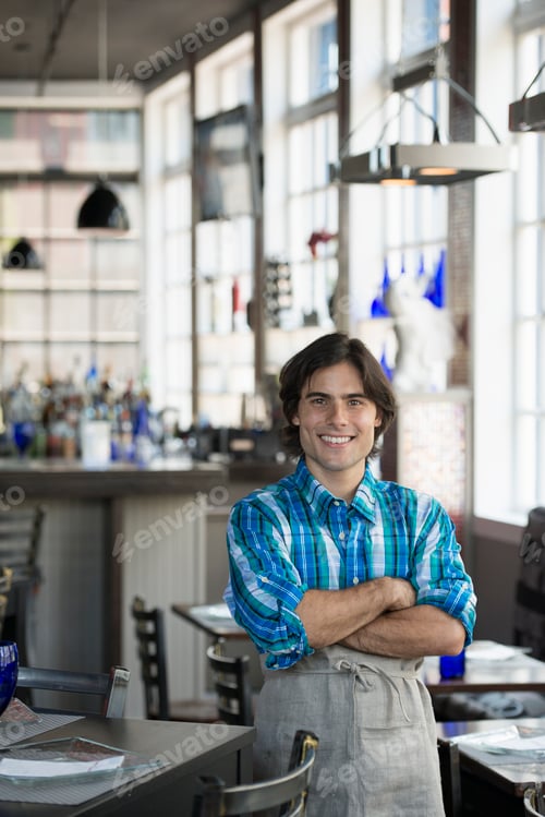Preview: A cafe interior. A waiter in a checked shirt.